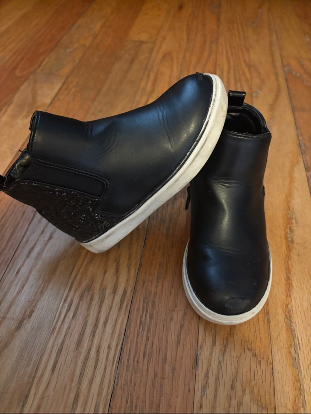 Black zip up boots. Glitter on the back and sides perfect for any outfit!
